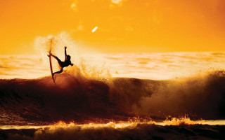 Surfer air wave sunset cliff - a surfer free wallpaper
