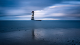 Lighthouse beach cloudy sky reflection - long exposure free wallpaper for desktop