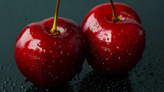 Red apples water droplets black - a black surface free wallpaper for desktop