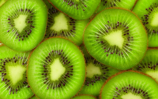 Kiwi sliced pattern green nature - a white background free wallpaper