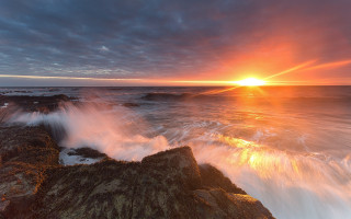 Sunset ocean waves rocks bridge - a sunset over the ocean free wallpaper