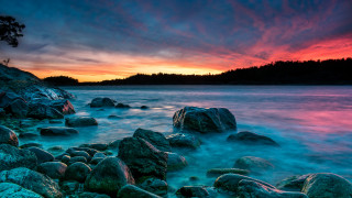 Sunset rocky beach mystical colors 5 - a sunset over a rocky beach free wallpaper
