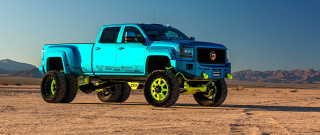 Blue truck yellow wheels desert - a blue truck free wallpaper
