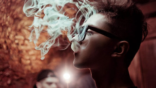 Woman glasses smoke light wall - front of a wall free wallpaper