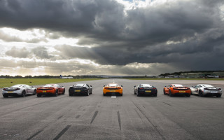 Sports cars runway cloudy sky - a runway under a cloudy sky free wallpaper