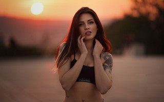 Tattooed woman sunset beach cinematic - under her chin free wallpaper