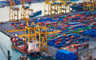 Harbor container ship tilt shift - a smaller boat free wallpaper