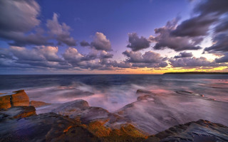 Rocky beach sunset clouds cityscape - a rocky beach free wallpaper