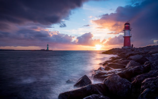 Lighthouse rocky shore sunset clouds 7 - a rocky shore free wallpaper for desktop