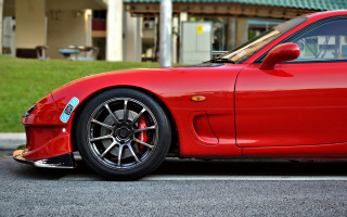 Red sports car parked building 3 - the side of the road in front free wallpaper for desktop