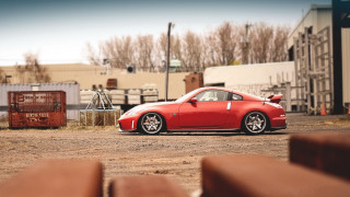 Red car parked building fence - anthony s waters free wallpaper
