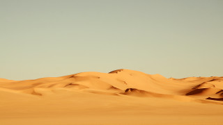 Sand dunes plane sky ocean - single free wallpaper