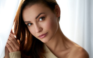 Woman blowing hair brown eyes - adrienn henczné deák free wallpaper