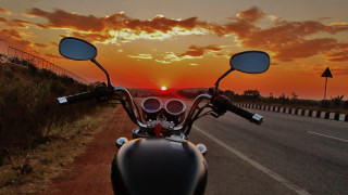 Motorcycle parked sunset road distance - the side of a road free wallpaper