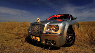 Silver skull car field blue - dry grass free wallpaper