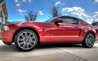 Red mustang driveway house trees - a house and trees free wallpaper