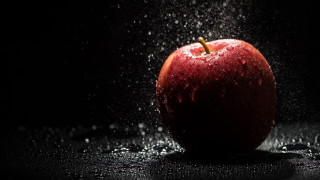 Water splash apple black background - a red apple free wallpaper for desktop