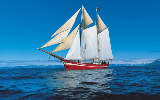 Sailboat ocean mountains blue sky - american romanticism free wallpaper