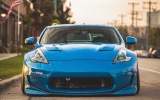 Blue sports car american flag - the side of the road in front free wallpaper