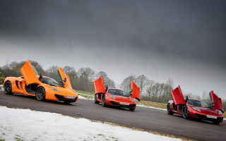 Orange sports cars snowy road - the ground and trees free wallpaper
