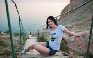 Woman ocean cliff fishing blurry - claire dalby free wallpaper