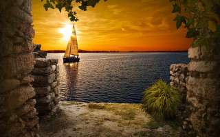 Sailboat sunset archway beach matte - a sailboat free wallpaper