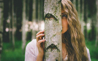 Woman holding tree face forest - a face free wallpaper