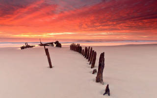 Beach fence redsky clouds dusk - a red sky in the background free wallpaper