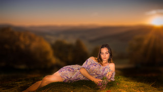 Woman dress laying flower sunset - a woman in a dress free wallpaper