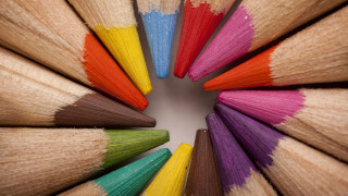 Colored pencils circle complementing colors - a white background behind them free wallpaper