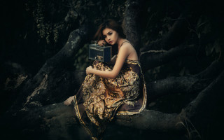Woman sitting tree branch book - cinematic photography free wallpaper for desktop