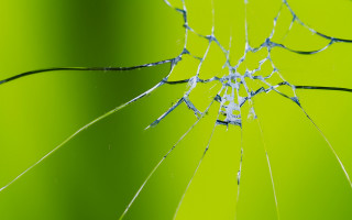 Broken glass green background white - a hole free wallpaper