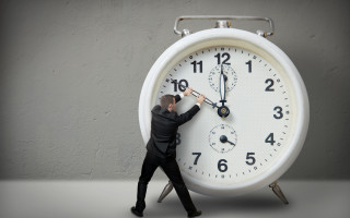 Man pushing clock suit stand - a stand free wallpaper