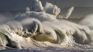 Large wave beach lighthouse cloudy - the shore of a beach free wallpaper