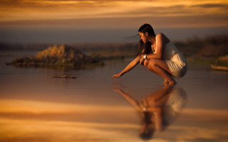 Woman beach reflection rock sunset - elke vogelsang free wallpaper