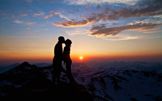 Mountain sunset couple clouds romantic - the sun setting behind them free wallpaper for desktop