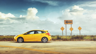 Yellow car road sign cloudy - a road sign free wallpaper