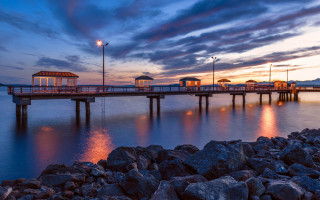 Pier lighthouse sunset rocks cloudy - rock free wallpaper