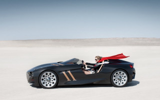Woman black sportscar red cape - roof free wallpaper