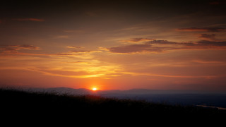 Sunset horse rider mountains cityscape - a horse free wallpaper for desktop