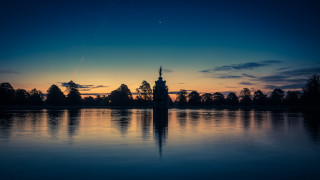 Lake clocktower sunset plane wren - a large body of water free wallpaper