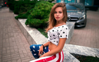 Woman american flag skirt city - a car in the background free wallpaper