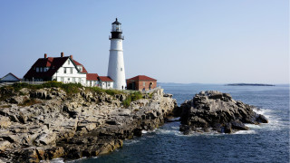 Lighthouse rocky cliff ocean boat - the water below free wallpaper