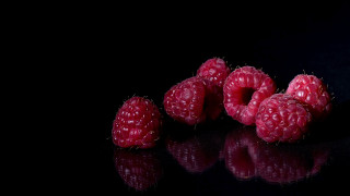 Raspberries black surface reflection food - the surface free wallpaper
