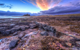 Rocky beach island cloudy sunset - a sunset in the distance free wallpaper