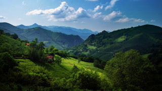 Lush green hillside house mountains 2 - a lush green hillside free wallpaper