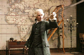 Man green coat pointing map - a green coat free wallpaper