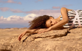 Woman rock stretching arm beach - elinor proby adams free wallpaper