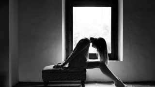 Woman sitting bench window crossed - a suitcase free wallpaper