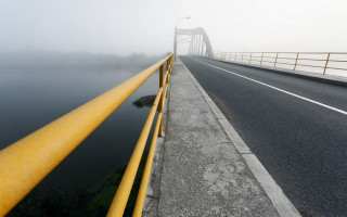 Foggy road yellow railings water - smooth free wallpaper for desktop